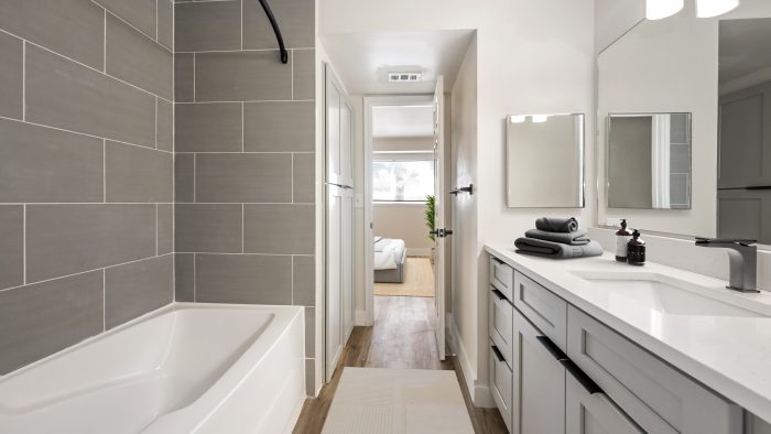 a bathroom with a tub and a shower stall at The Palm Haven